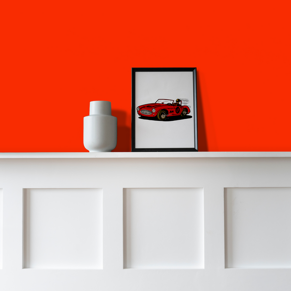 wall painted in Racing Red Matt Emulsion Paint decorated with picture and vase