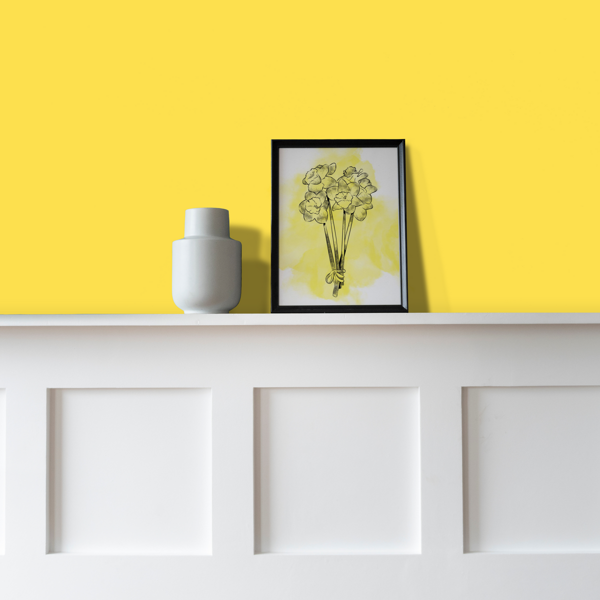 wall painted in Yellow Maiden Matt Emulsion Paint decorated with picture and vase